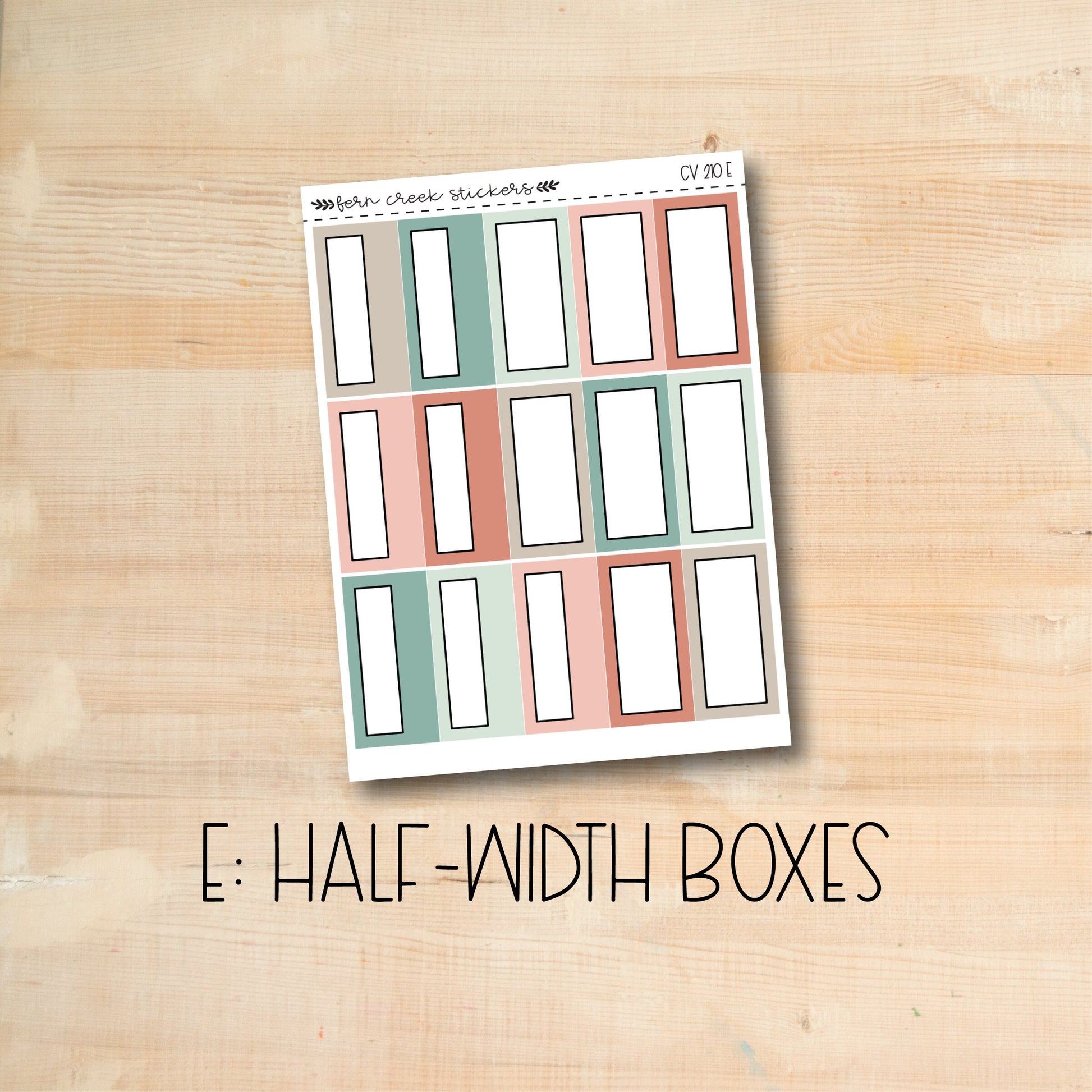 the e half - width boxes are lined up on a wooden surface